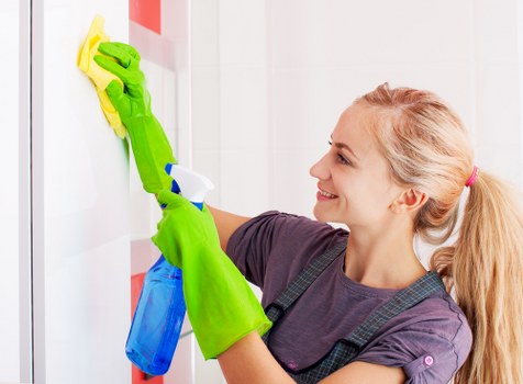 Professional office cleaners working in a Bermondsey workspace