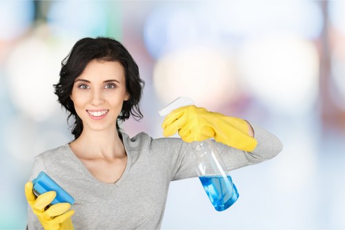 Cleaner preparing equipment and reviewing a property cleaning booking